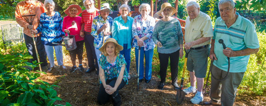 Mary Ott, lower, is pictured with her senior group who aids her in the garden at Merrill Gardens at Florence. Pictured are from left: John Hambrick, Betty Chasteen, Jimmie Butts, Geoff Keener, Lucy Thomas, Virginia Wilson, Peggy Ratliff, Emma Ginther, Bob Torbert, Paul Kollfrath, and Mary Donna Ott (kneeling).