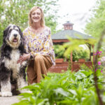 Amanda Simpson and her K9 partner, Bernie, pose for a portrait at the Renaissance of Florence on Tuesday, April 22, 2025, in Florence, Ala.