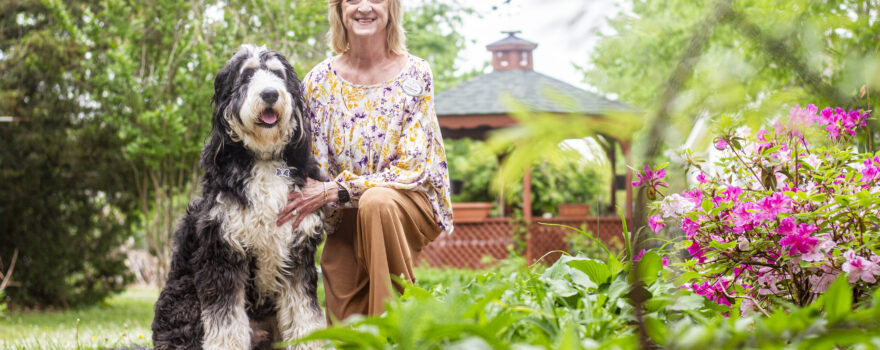 Amanda Simpson and her K9 partner, Bernie, pose for a portrait at the Renaissance of Florence on Tuesday, April 22, 2025, in Florence, Ala.