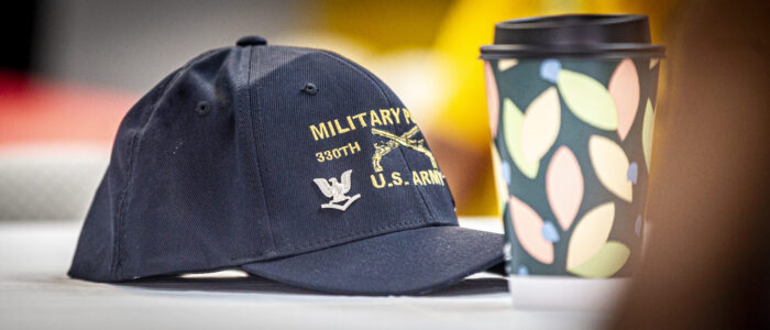 A Military Police member’s hat appears during a meeting on Monday, April 28, 2025, in Sheffield, Ala.