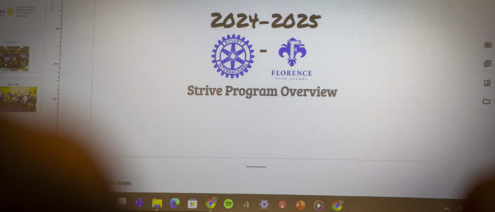 A slide highlighting Dihanne Westfield's STRIVE program — a mentorship initiative developed in partnership with Florence High School that connects Rotary members with FHS students — is shown during a Florence Rotary Club meeting on Monday, May 5, 2025, in Florence, Ala.