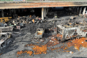 An aerial view of the 10 Freeway on Nov. 13, 2023, after a large pallet fire burned below, shutting the freeway to traffic.