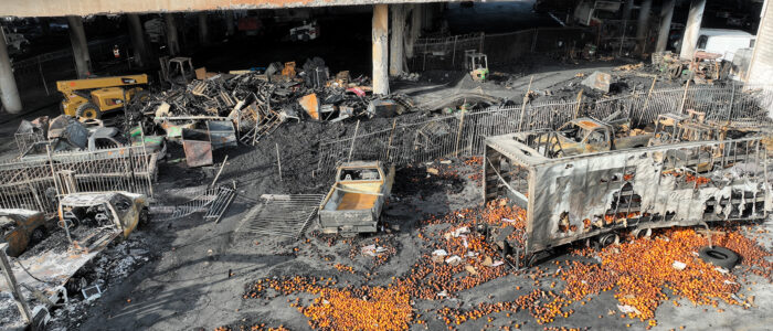 An aerial view of the 10 Freeway on Nov. 13, 2023, after a large pallet fire burned below, shutting the freeway to traffic.