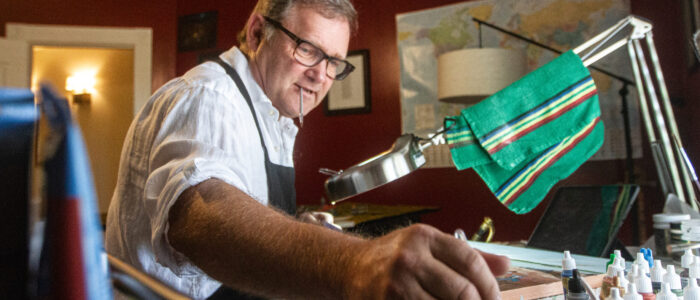 Kurt Vetters mixes paint in his Florence, Ala., studio.