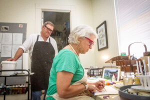 Kurt Vetters, left, watches as his wife, Donna Steele.