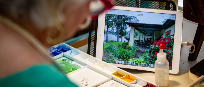 Donna Steele uses her iPad for a photo reference.