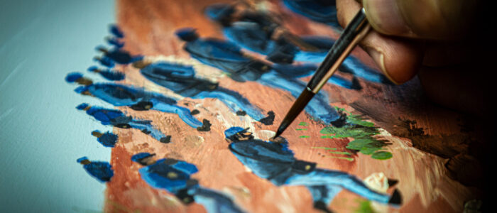 Kurt Vetters adds detail to a soldier’s uniform.