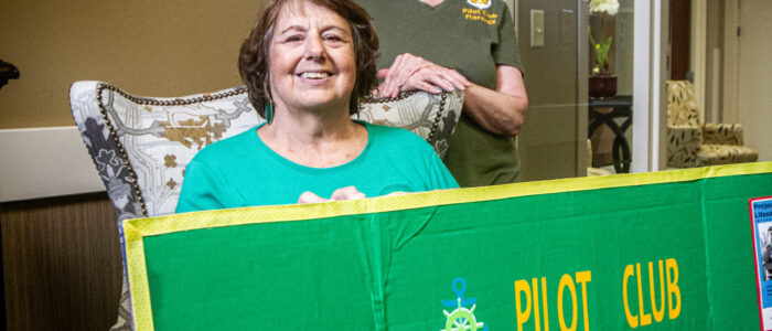 Florence Pilot Club members Mary June Jankowiak, left, and Pam Belew pose with the club’s project board.