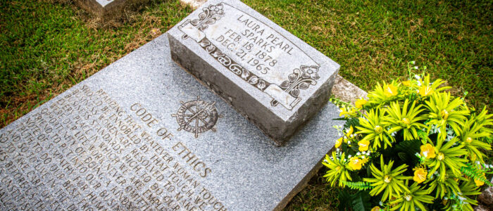 A floral arrangement rests at the gravesite of Laura Pearl Sparks.