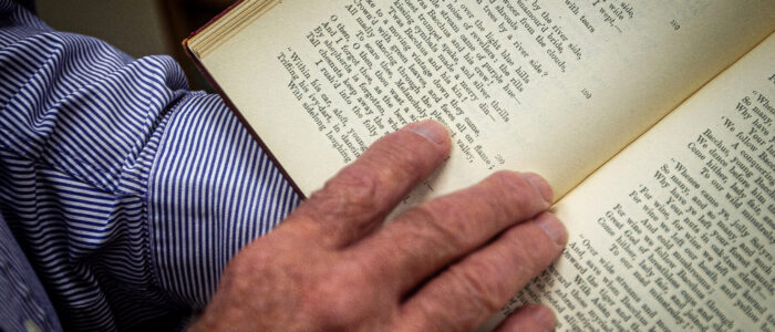 Billy Ray Warren reads through a historic volume in his office.