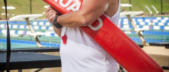 Gloria “Gigi” Broadway poses with a lifeguard rescue tube