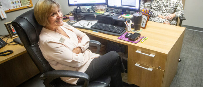 Gloria “Gigi” Broadway, left, talks with a colleague