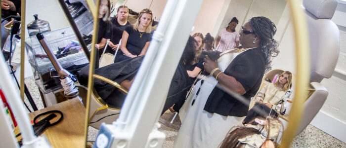 LaSondra Stanford demonstrates hair pressing