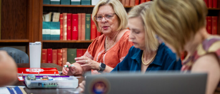 Nancy Ann Sherman, center, participates in a Shoals Area Lions Club meeting