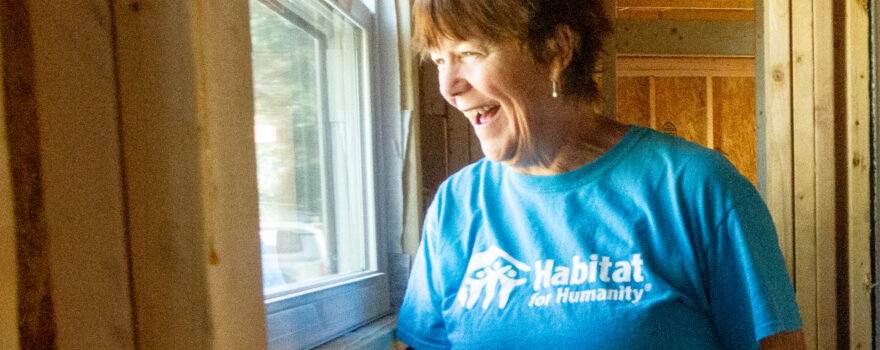 Jacqueline Broder looks out a recently installed window
